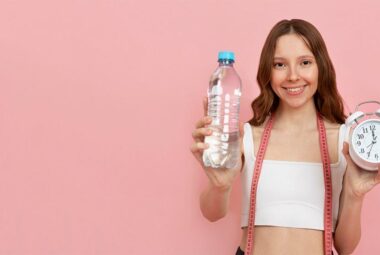 beautiful woman holding a bottle of water